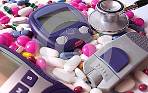 Devices for measuring blood sugar level and pills photo