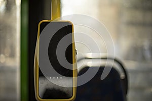 Devices for paying for bus fares. Interior of bus. Electronic cashier. NFC sensor for payment