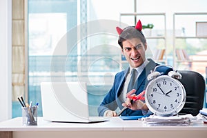The devil angry businessman in the office