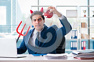 The devil angry businessman in the office