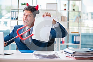 The devil angry businessman in the office