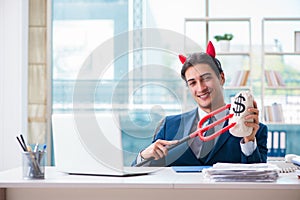 The devil angry businessman in the office