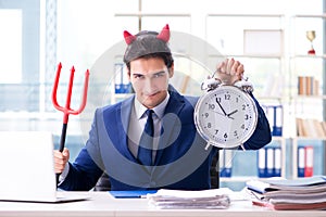 The devil angry businessman in the office
