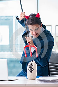 The devil angry businessman in the office