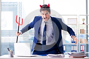 The devil angry businessman in the office