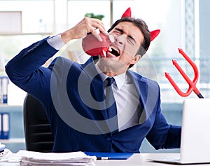 Devil angry businessman in the office