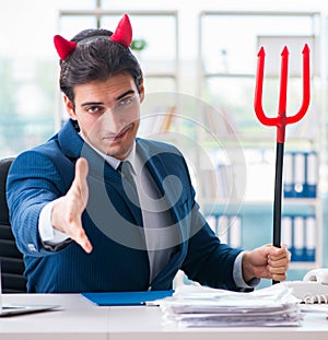 Devil angry businessman in the office