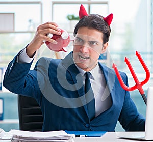 Devil angry businessman in the office