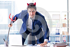 The devil angry businessman in the office