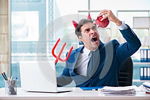 The devil angry businessman in the office