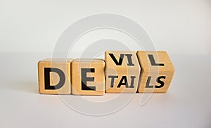 Devil in the details symbol. Turned cubes and changed the word `details` to `devil`. Beautiful white background. Business and