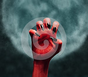 Devil hand at midnight