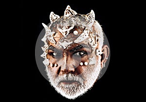 Devil man with bloody eyes. Design for Halloween banner. Halloween bearded man with blood make-up. Horror with scary