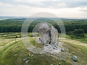 Devil rock in Pidkamin, Lviv region, West Ukraine summer landscape