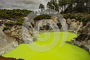 Devil`s Bath, a green sulphur lake at Waotaipu Thermal Wonderland in New Zealand. photo
