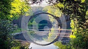 Devil's Bridge Rakotzbrucke in the Rhododendron Palace Landscape Park Kromlau, Lake Rakotz, Saxony, Germany