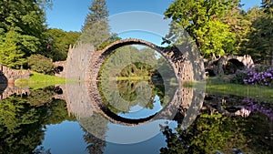 Devil's Bridge Rakotzbrucke in the Rhododendron Palace Landscape Park Kromlau, Lake Rakotz, Saxony, Germany