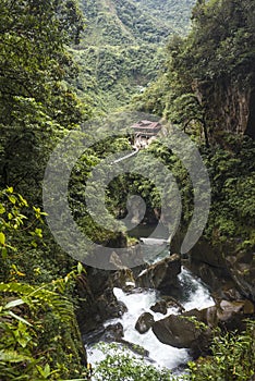 Devil`s Cauldron waterfall in the Andes - Banos. Ecuador photo