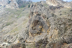 Devil\'s fireplace rock and bizarre rocks in Dead city. Khoba-Tele Ridge of Karadag Reserve in spring. Crimea