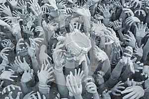 Devil's Hands from Hell in Rongkhun Temple or White Temple in Chiangrai, Thailand