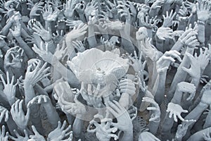 Devil's Hands from Hell in Rongkhun Temple or White Temple in Chiangrai, Thailand
