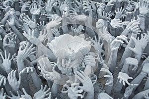 Devil's Hands from Hell in Rongkhun Temple or White Temple in Chiangrai, Thailand photo