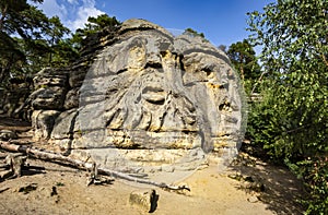Devil`s Head Certovy Hlavy, two faces carved in sandstone rocks, Kokorin Forest, Village Zelizy, Czech Republic