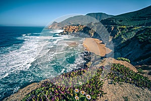 Devil`s Slide sheer cliffs and pacific coast in San Mateo County