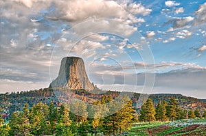 Devil`s Tower National Monument Under the Early Morning Cloudy Sky