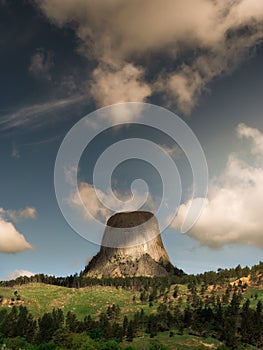 Devil`s Tower in Wyoming during the day with dramatic clouds