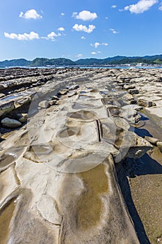 Devil`s Washboard coastline and beach in Aoshima island, Miyazak