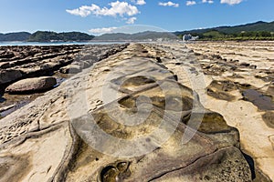 Devil`s Washboard coastline and beach in Aoshima island, Miyazak photo