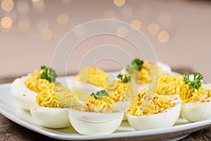 Deviled eggs garnished with parsley and paprika