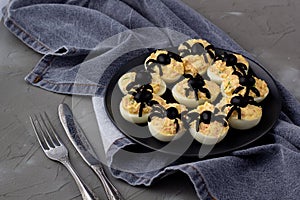 Deviled Eggs With A Spider For Halloween Party