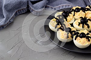 Deviled Eggs With A Spider For Halloween Party