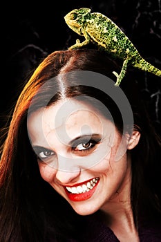 Devilish woman with chameleon