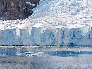 Deville glacier calving in Andvord Bay near Neko Harbor, Arctowski Peninsula, Antarctica