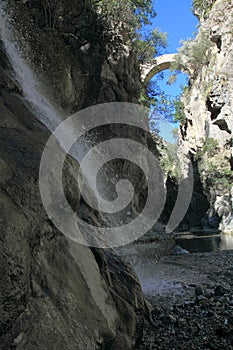 The Devils Bridge and waterfall in Gole del Raganello photo