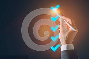 Businessman hand tick correct sign mark in checkbox quality document control checklist