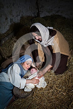 Devoted parents in Christmas nativity scene