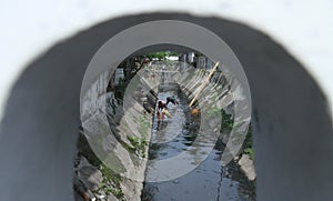 Devotedly residents clean up the river in the city of Solo in Central Java Indonesia
