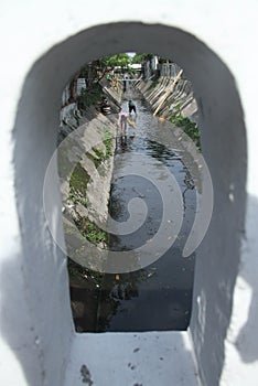 Devotedly residents clean up the river in the city of Solo in Central Java Indonesia