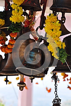 Devotional bells and flowers in a hindu temple