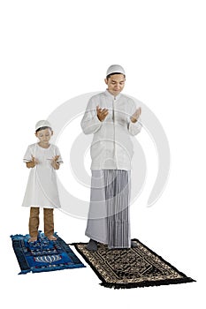 Devout family prays to the Allah