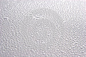 Dew drops on painted metal surface