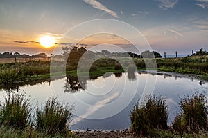 A Dew Pond on Ditchling Beacon at Sunset