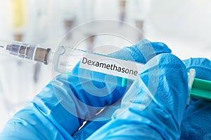 Dexamethasone drug syringe in blue gloved hands