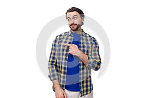 dexterous smart well-groomed brunette brutal man with a beard in a plaid shirt is inspired by strategy