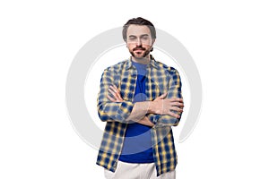 dexterous smart well-groomed brunette brutal man with a beard in a plaid shirt is inspired by strategy