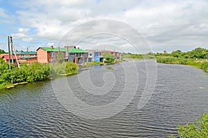 The Deyma River with houses ashore. Polessk, Kaliningrad region
